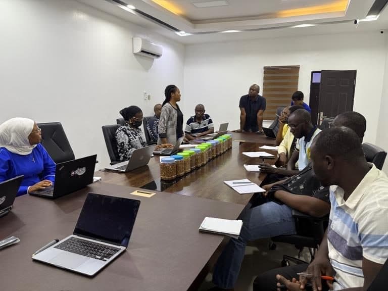 Growth Stack consultants running a requirements workshop with a client team around a boardroom table