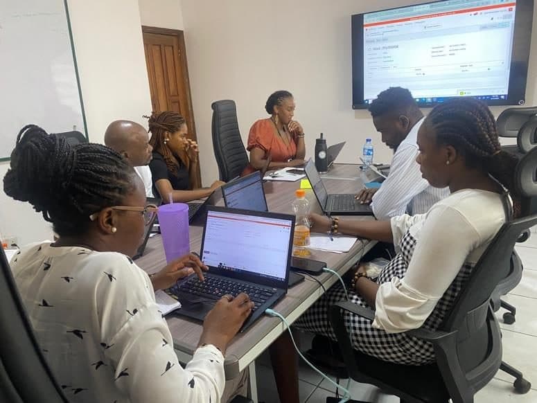 Operations staff working in Odoo on laptops during an inventory setup session